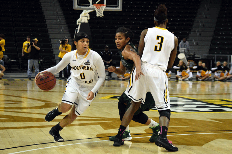 Shar'Rae Davis (0) uses a screen set by Rebecca Lyttle (3) to drive around a defender Thursday night against USC Upstate.