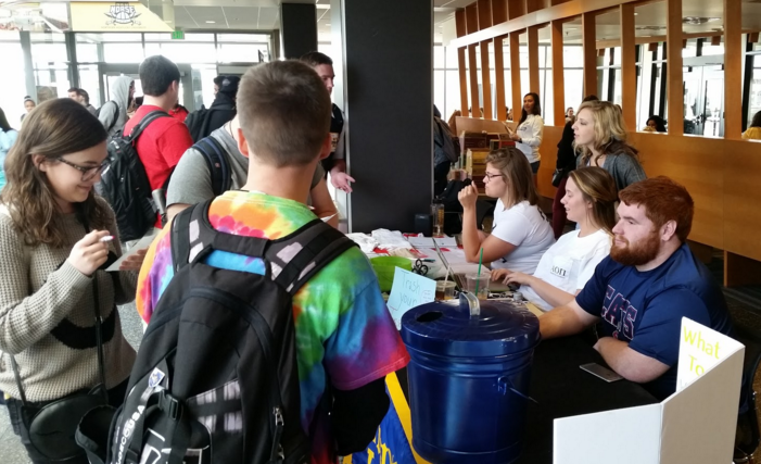 Students stop by Alpha Phi Omega's booth in the Student Union to get rid of their insecurities. The project, Trash Your Insecurities," was aimed at helping people to better their self-empowerment.