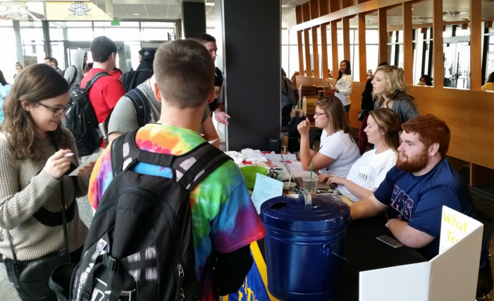 Students stop by Alpha Phi Omegas booth in the Student Union to get rid of their insecurities. The project, Trash Your Insecurities, was aimed at helping people to better their self-empowerment.