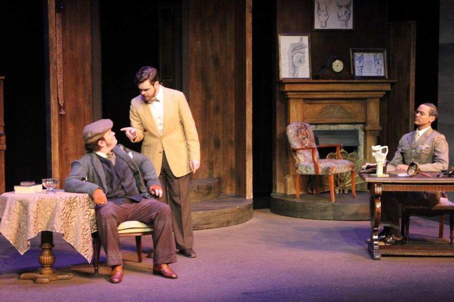 The characters in this scene are Henry Higgins played by Justin Woolums, Colonel Pickering played by Taylor Greatbatch and Alfred Doolittle played by Zach Robinson. This scene is when Alfred is trying to get Higgins to pay him five pounds.