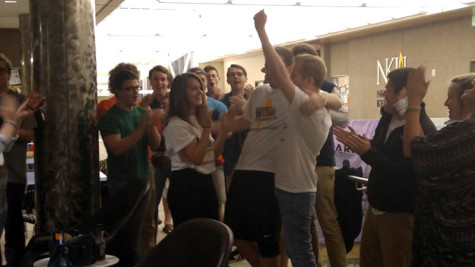 Vice President Ellen Wilshire, President Will Weber and their campaign manager Patrick Reagan celebrate as the pair is declared the winners.