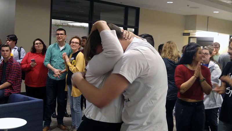 Newly-elected President Will Weber embraces his mother, Janice Weber, after he is declared student body president. 