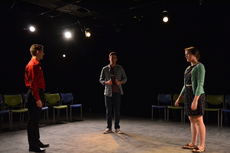 Colin Kissel's (John) two love interests, George Ivan (Man) and Hallie Hargus (Woman), share an awkward introduction during rehearsal for "Cock".