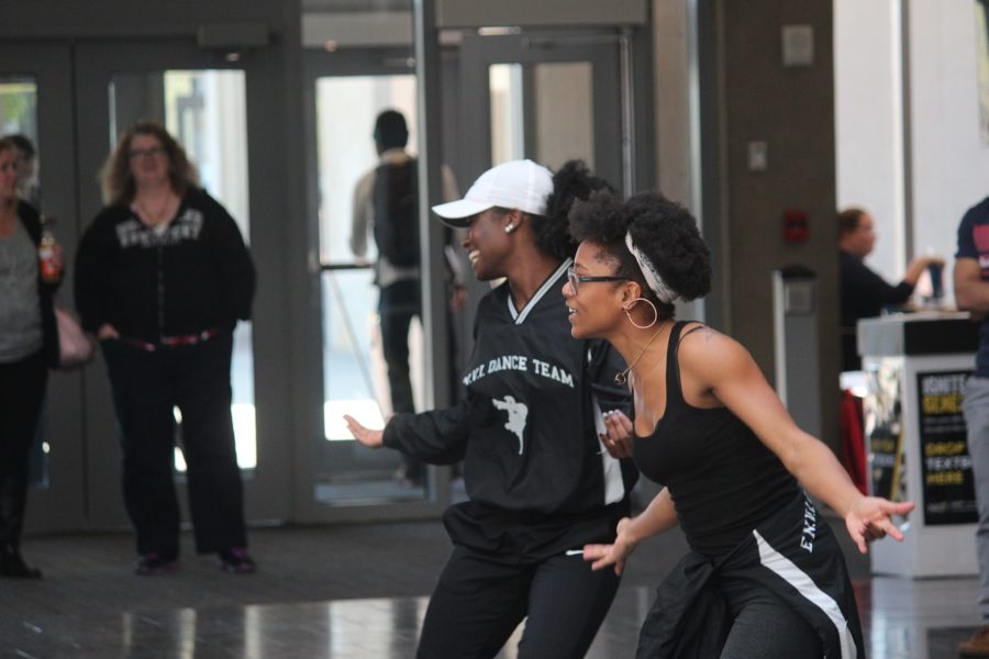 Seniors, Rhonisha Gentry and Valencia Stallings steps in the join on other side of the dance battle and hypes the crowd while getting ready to perform the rest of their routine. 