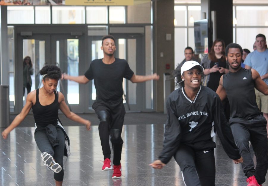 ENVI dancers flood into the Student Union hallway with a flash mob performance.