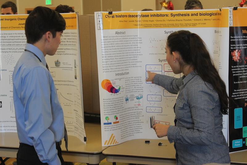 Alma Oñate, a senior at NKU, explains her research to crowd at the Celebration of Student Research and Creativity.