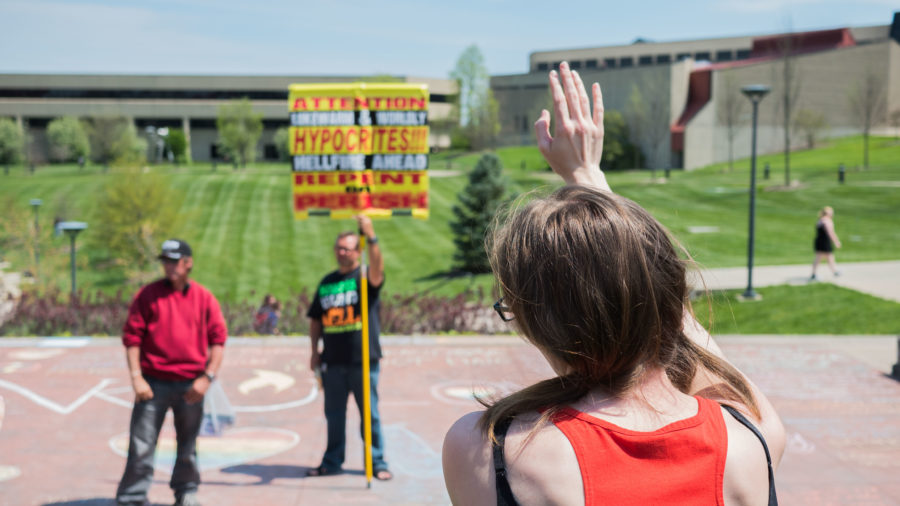 Several students sat in the amphitheater throughout the day viewing and arguing with the street protestors. Other organizations attempted to draw the crowd away from the pair, citing the protest as creating a negative atmosphere. 