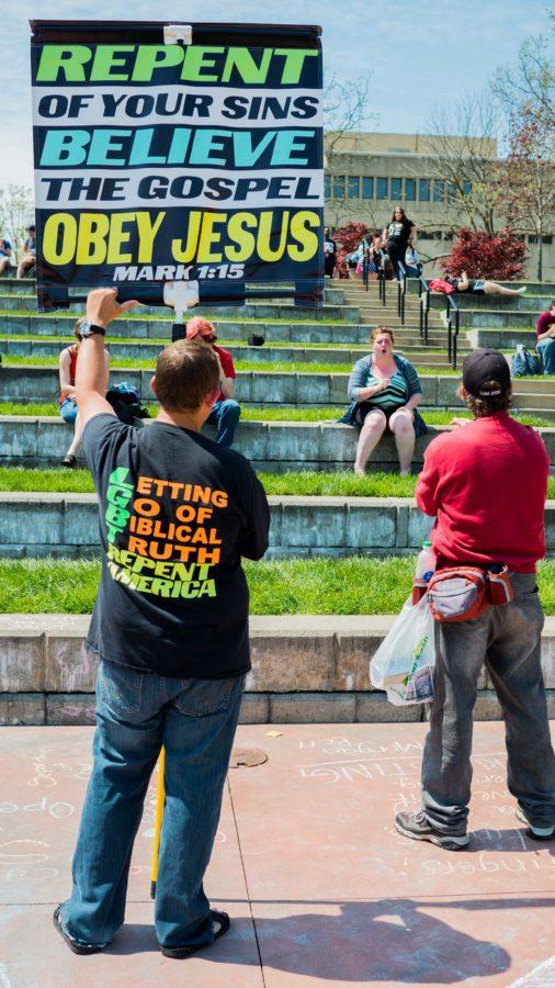 The duo carried signs calling for repentance. They believe that resistance to their protest stems from people unwilling to change or accept their version of Christianity. 