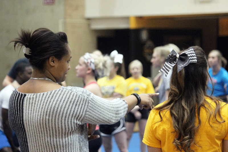 Coach Shayla Myles-Aaron (left) and Baillee McClain at cheerleading practice.