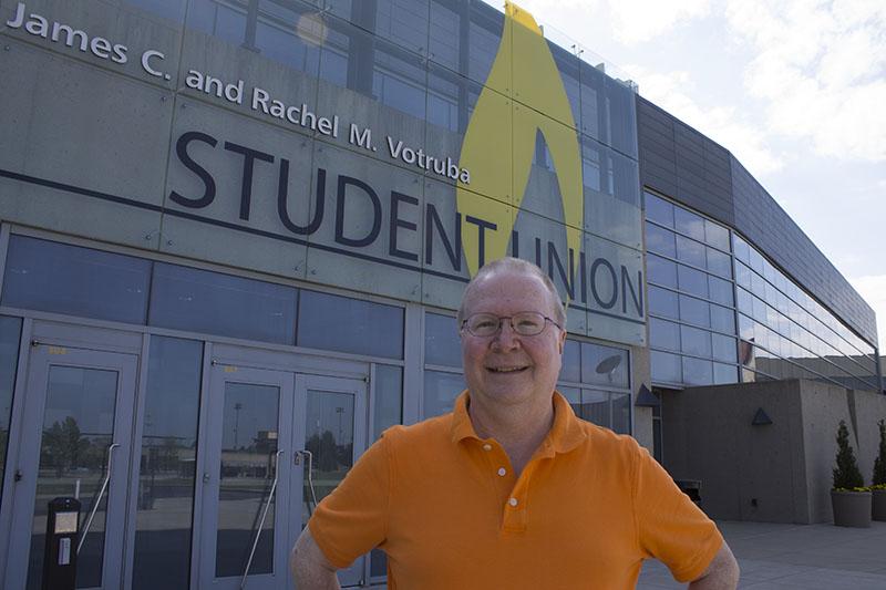 Dr. Proctor stands in front of the Student Union, which is named after one of his dearest friends, former NKU President James Votruba.