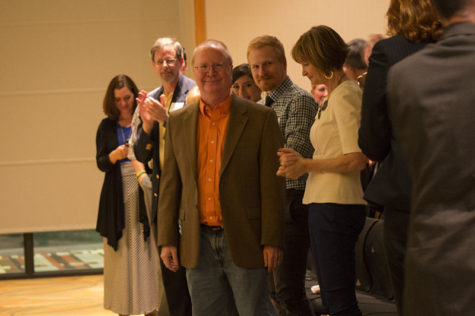 Dr. Russell Proctor stands surrounded by family and friends as they cheer him on for his career at NKU. Dr. Proctor is retiring this semester after 25 years at NKU.