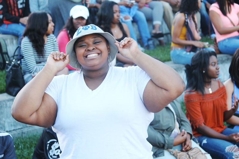 Brandy Mulligan, NKU junior and member of Zeta Phi Beta sorority, represents her organization before performing in the show. Other Zetas showed their colors of blue and white to represent.