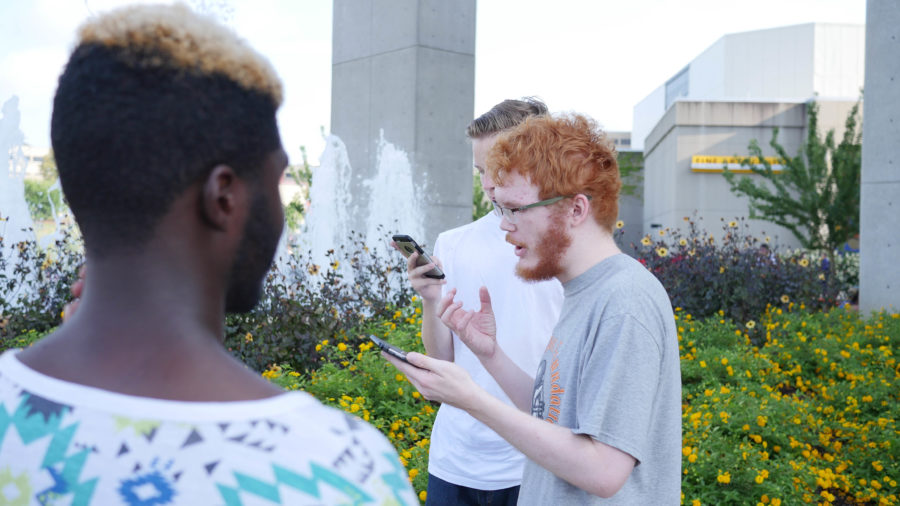 William Heekin (middle) explains how social Pokemon GO is. He was 'baffled' by the number of players at NKU on Tuesday. 