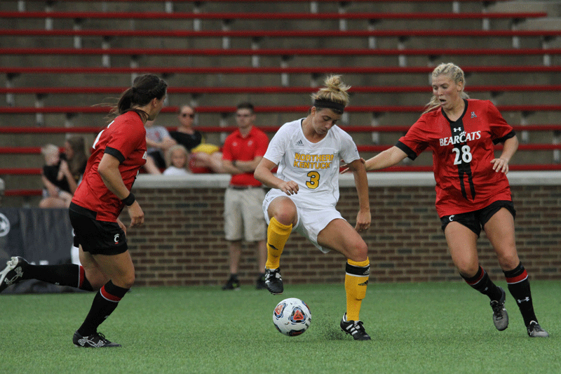 NKU forward Macy Hamblin tries to avoid the UC defense