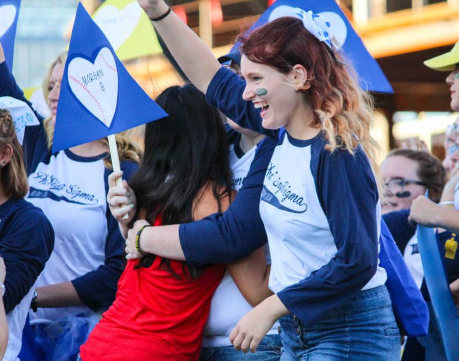 One by one, the new members are released to their chapters and love and tutus engulf the women.