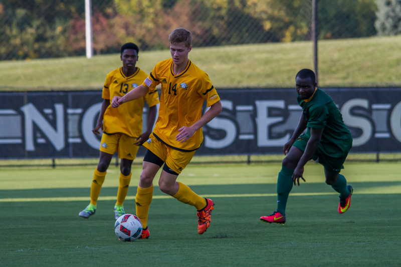 Tucker Monheimer dribbles against Wright State