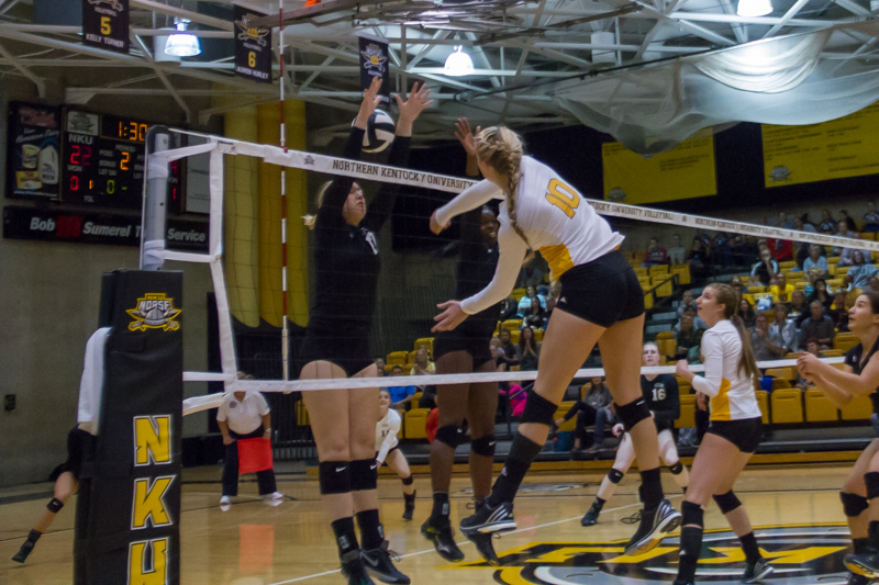 Tristen Simpson hits a ball through the arms of a would-be Cleveland State blocker. Simpson recorded 18 blocks in the match but the Norse would end up losing.