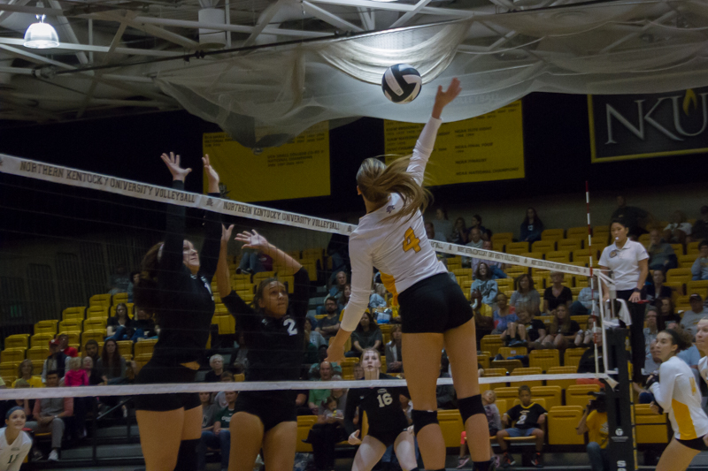 Haley Libs jumps to spike a ball past the Cleveland State blockers. CSU would go on to win the match 3-2.