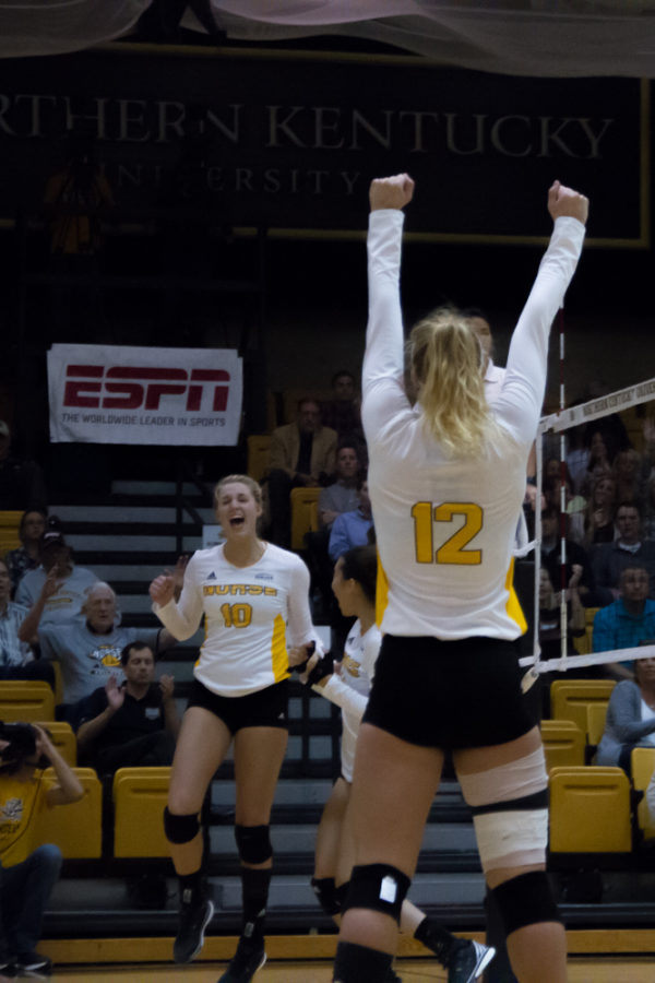 Laura Crawford and Tristen Simpson celebrate after earning a point. The Norse would lose to Cleveland State in five sets.