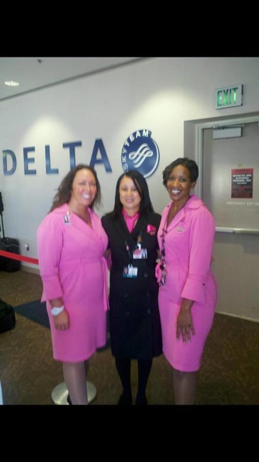 (From left to right) Niki Ross, Lori Hawkins-Gunn and Shanda Harris pose for a picture before working a Comair flight. 