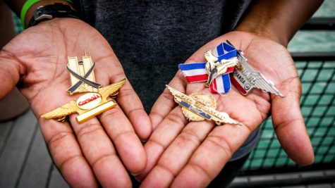 Shanda Harris displays her flight attendant pins in the palms of her hand. She was working a flight to North Carolina the day of the 9/11 attacks.