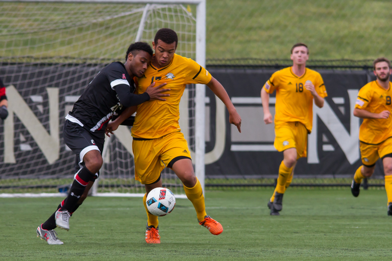 Kobie Qualah fights for the ball with a UC defender. The Norse tied with UC 0-0.