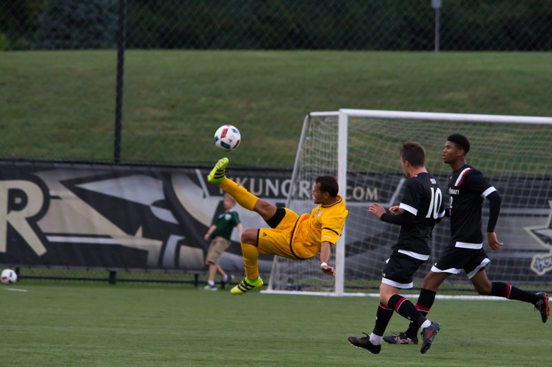 Alwin Komolong attempts a bicycle kick in Wednesdays game against UC.