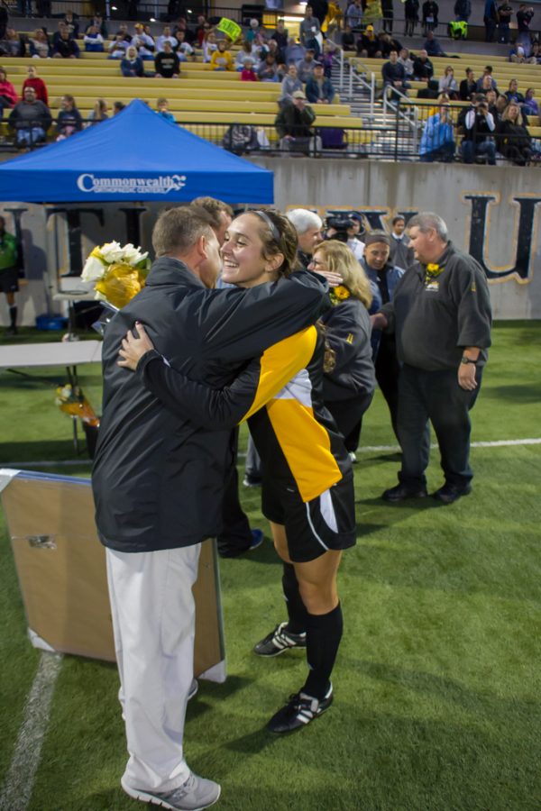 Senior Chrissy Spears shares a hug with head coach Bob Sheehan prior to Fridays game with Valparaiso.  