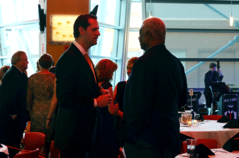 NKU men's basketball coach John Brannen (left) and University of Cincinnati basketball legend Oscar Robertson (right) chat during the