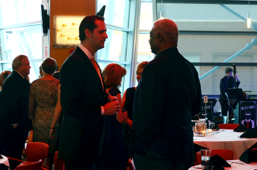 NKU mens basketball coach John Brannen (left) and University of Cincinnati basketball legend Oscar Robertson (right) chat during the Night with the Norse gala Oct. 8 at Great American Ball Park.