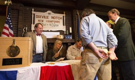 Voters in Dixville Notch, N.H., get their ballots Tuesday, Nov. 8, 2016, in Dixville Notch, N.H. The residents in town voted just after midnight. (AP Photo/Jim Cole)