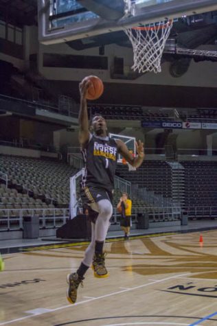 Jordan Garnett goes up for layup in a drill during open practice on Norse Media Day