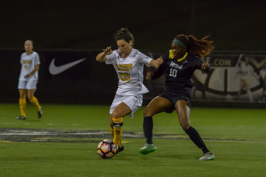 Katelyn Newton tries to dribble around a Wright State defender. The Norse beat the Raiders 1-0 in the quarter finals of the Horizon League tournament