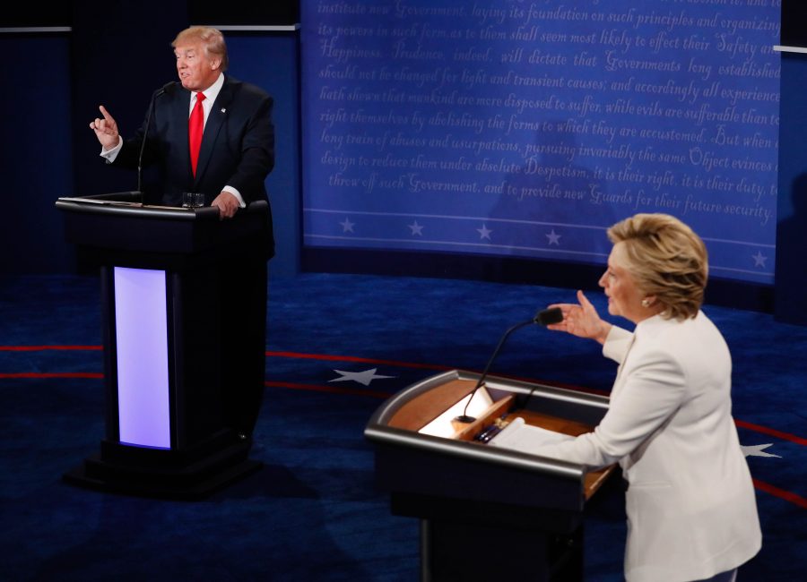 FILE - In this Oct. 19, 2016 file photo, Democratic presidential nominee Hillary Clinton and Republican presidential nominee Donald Trump debate during the third presidential debate at UNLV in Las Vegas. Headed for history books, the duel between Hillary Clinton and Donald Trump became a battle of “nasty women” and “bad hombres” vs. “deplorables” and voters who are “irredeemable.”  (Mark Ralston/Pool via AP, File)