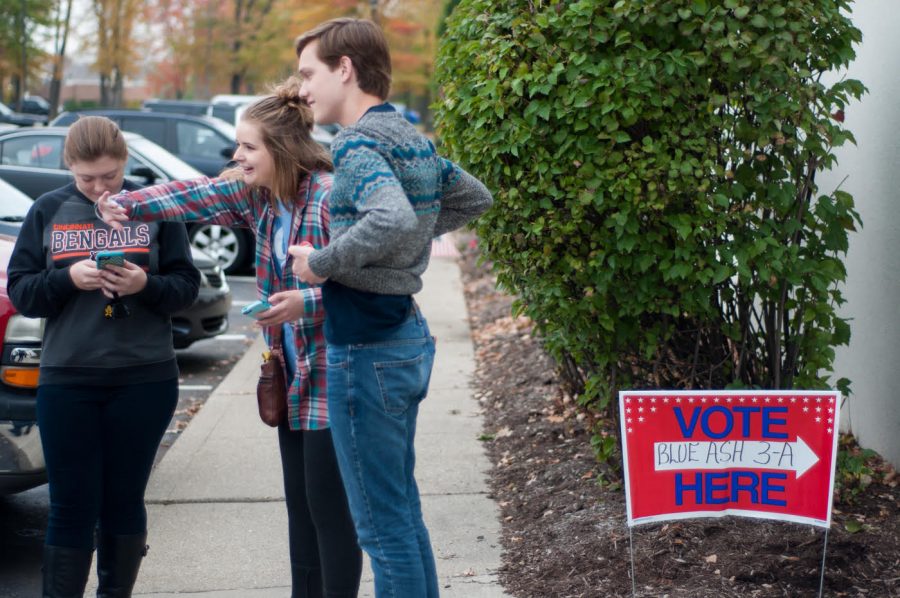 The crew waits anxiously while another member is voting, at Blue Ash. 