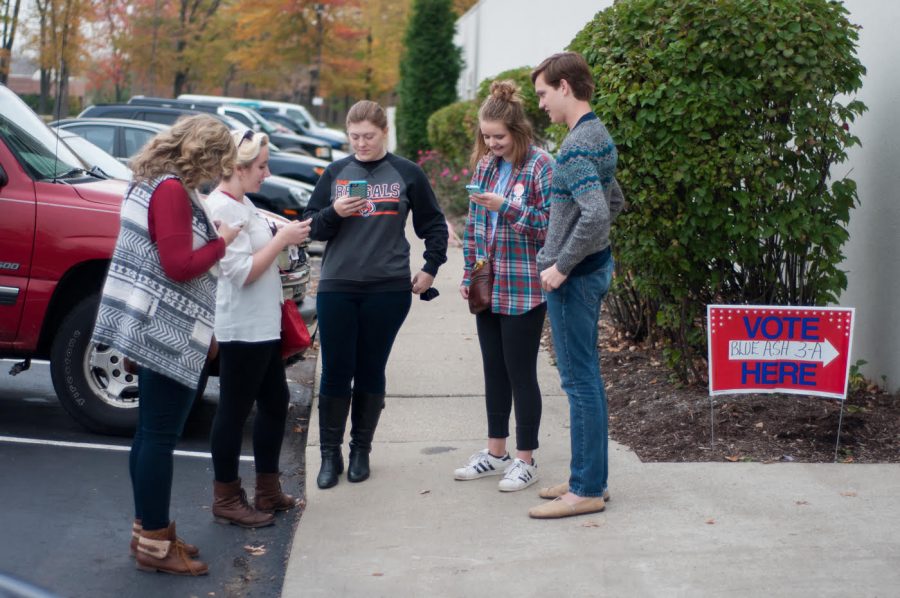 The group searches for Pokemon while waiting for other group members to finish voting. 