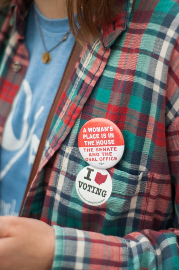 Kellyn Hoffert, after voting in Fairfield, wears her pins proudly, 