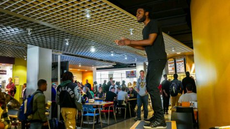 Charles Williams stood on a table near Coyote Jack's. On November 21 there will be a 'student talk' in the inclusive center for minority and majority students alike to come together in open conversation.  