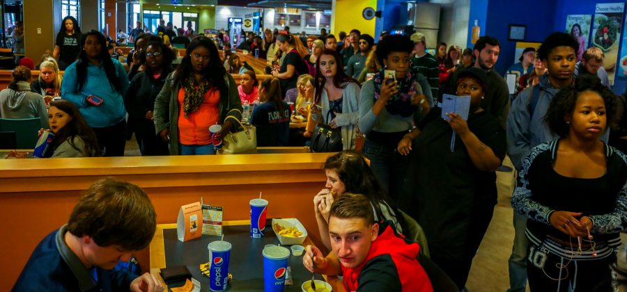 Students gather around the poets, absorbing the message of The Unaddressed. 