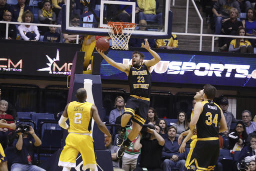 Northern Kentucky forward Carson Williams (23) drives to the basket during the first half of an NCAA college basketball game against West Virginia, Friday, Dec. 23, 2016, in Morgantown, W.Va. (AP Photo/Raymond Thompson)