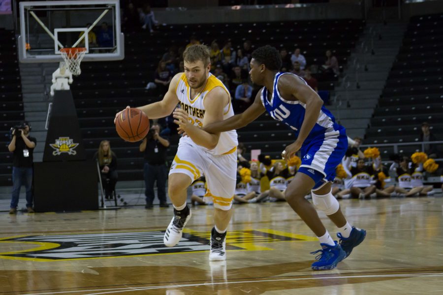 Carson Williams (23) dribbles around a defender during Wednesdays game against Eastern Illinois.