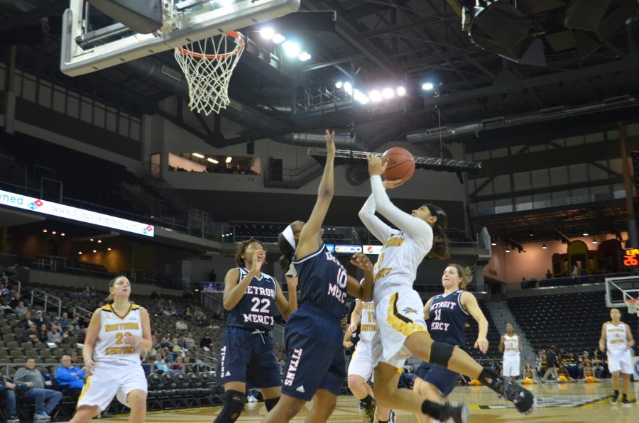 NKUs SharRae Davis goes up with the ball at BB&T Arena against Detroit on Sunday.