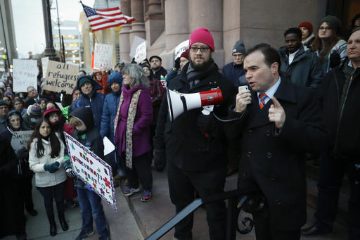 Cincinnati Mayor John Cranley speaks during a demonstration against President Donald Trump's executive order temporarily banning immigrants from seven Muslim-majority countries from entering the U.S. and suspending the nation’s refugee program Monday, Jan. 30, 2017, outside City Hall in Cincinnati. In addition, earlier in the day Cranley declared Cincinnati a "sanctuary city," meaning city will not enforce federal immigration laws against people who are here illegally, in keeping with current policy. (AP Photo/John Minchillo)