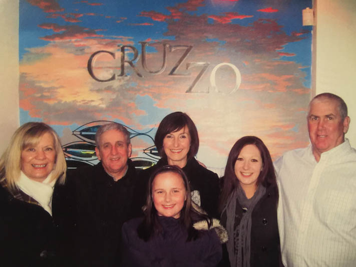 Linda (far left) and Basalyga (far right) stands with the Beattie family during their trip to Ireland