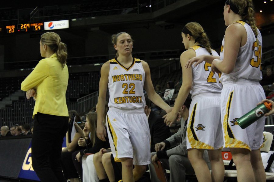 Kelley Wiegman high fives teammates on the bench in her final home game at BB&T Arena on Sunday.