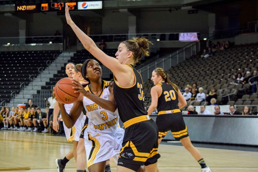 Rebecca Lyttle (3) goes up for a shot against Steph Kostowicz (32) during Fridays game against Milwaukee.