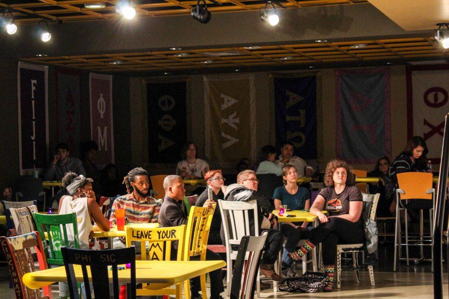 Students watch from the audience as participants perform at the 4th Annual LGBTQ Norse Pride Open Mic Night. 