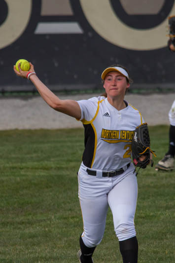 Outfielder Ava Lawson throws the ball back into the infield to keep runners from advancing .