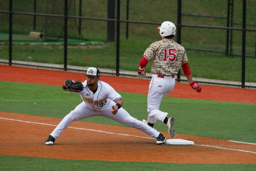 Trey Ganns stretches out to seal an out for the Norse at first base