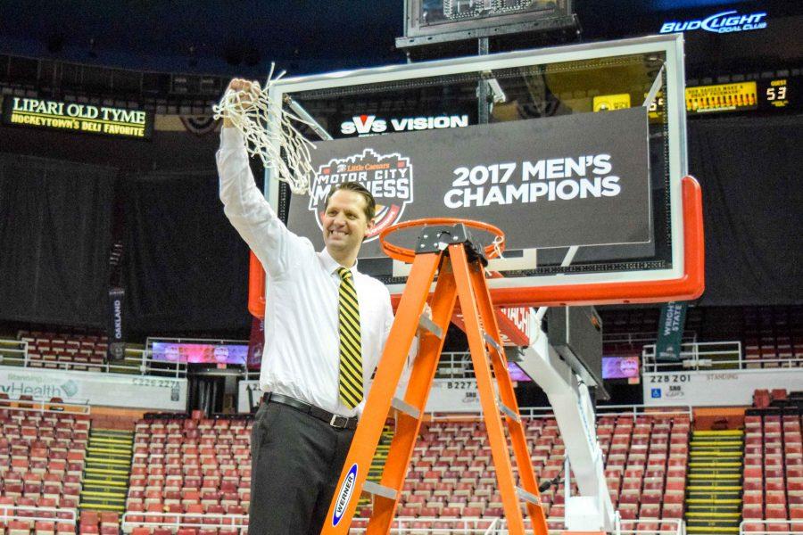 NKU head coach John Brannen celebrates after cutting the nets down at Joe Louis Arena.